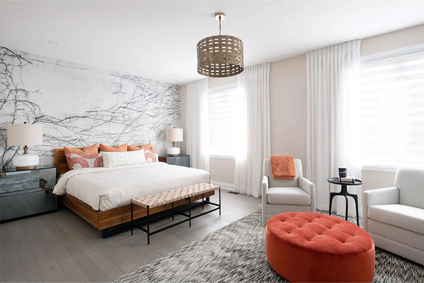 Minto Communities luxury master bedroom with marble accent wall, designer lighting, and premium finishes