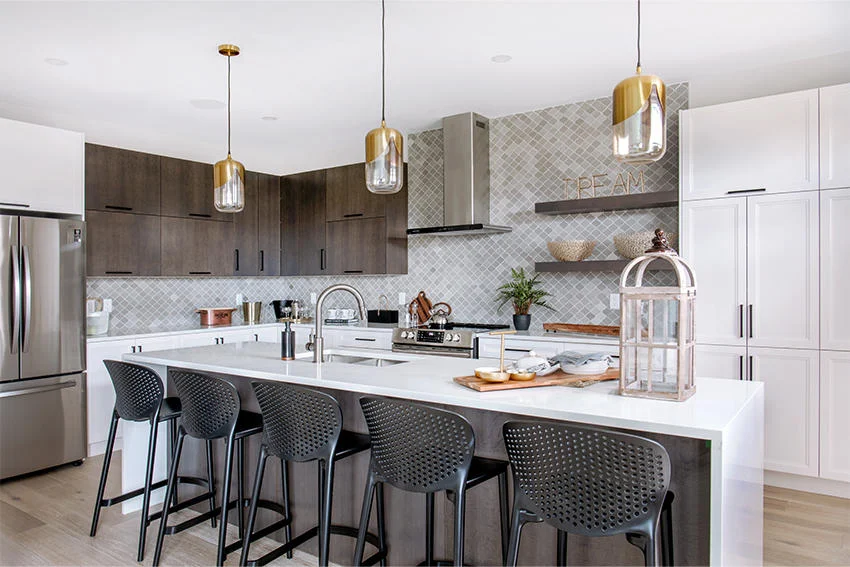Minto Communities modern kitchen design with quartz countertops, gold pendant lights, and arabesque tile backsplash